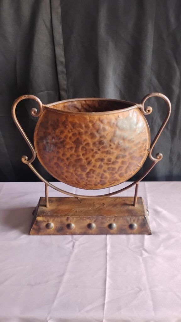 Metal tabletop Roman style pot. Bronze color.